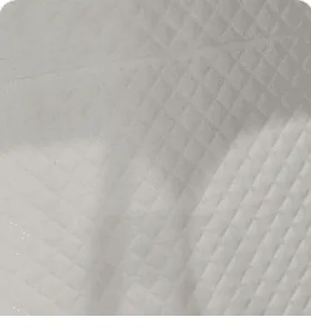 Close-up of warm cream quilted leather interior lining with diamond stitching